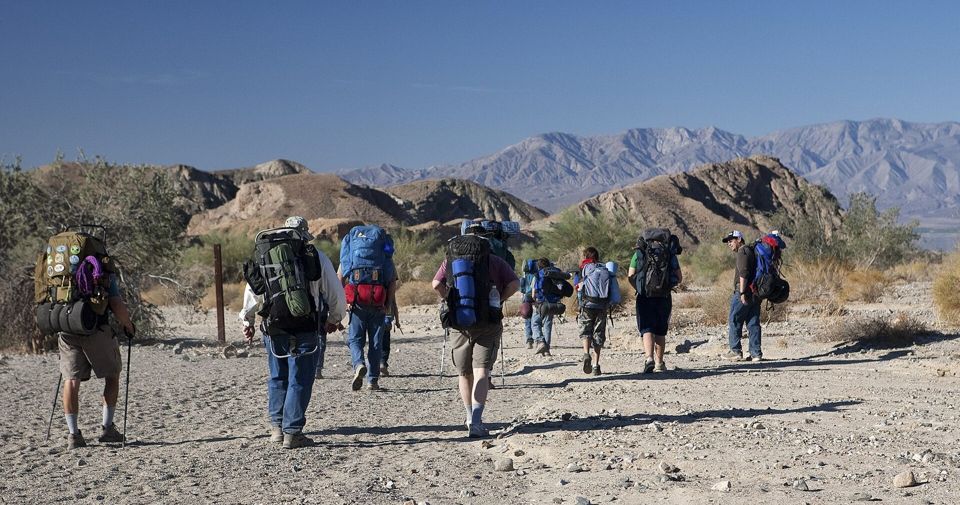 Hikers walking into Painted Canyon