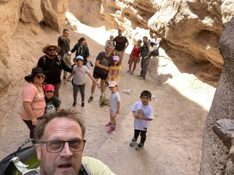 The whole crew — cousins, friends and DLI familia — in the mouth of Ladder Canyon