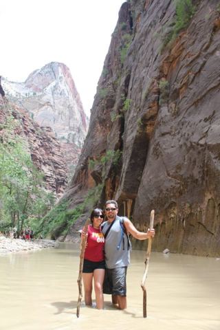 Wading the Virgin River in The Narrows, walking sticks required